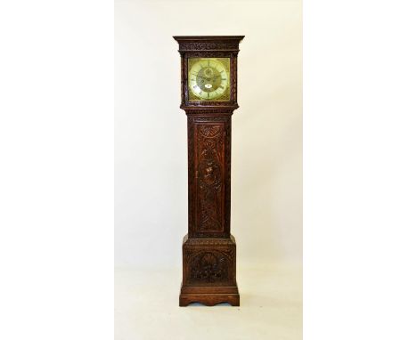 A mid 18th century carved oak eight day longcase clock, signed 'William Shaw, Botesdale', the hood with a carved frieze above