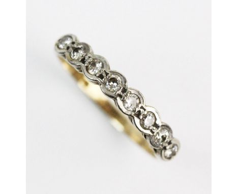 A diamond set 18ct gold half-eternity ring, comprising eight small brilliant cut diamonds claw set to a scalloped white gold 