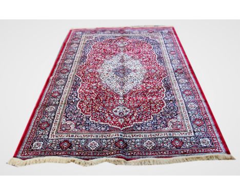 A red gound Kashmir carpet, with traditioanl floral medallion design, 300cm x 200cm 