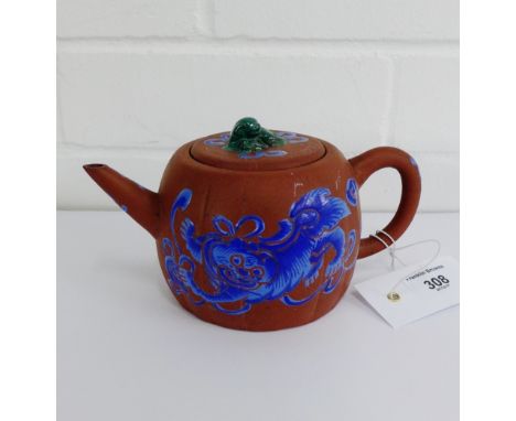 A Chinese Yixing teapot, the lid with a green glazed knop, 9cm high