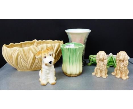 A collection of Sylvac pottery to include two vases, an oval planter, a seated terrier dog, and a Sylvac style locust and pai