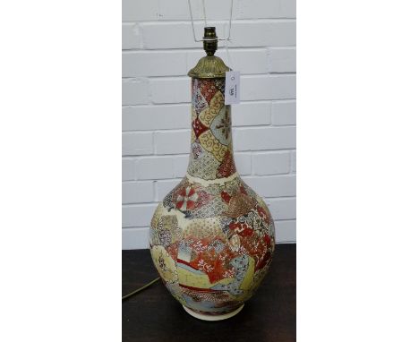 A Japanese earthenware bottle neck lamp base decorated with figures (with restoration), 60cm high excluding light fitting