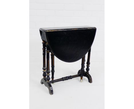 An ebonised and gilt Sutherland table, on ceramic castors, 54 x 50cm 