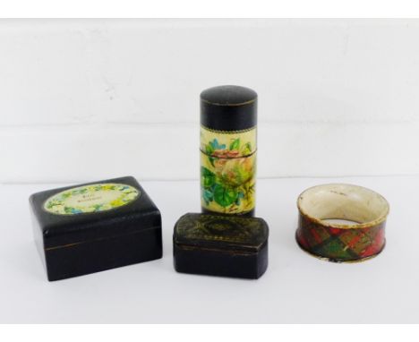 A 19th century papier mache snuff box, a tartan ware napkin ring and two ebonised trinket box and covers, (4) 