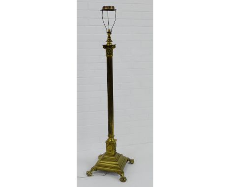 A brass Corinthian column standard lamp with paw and ball feet, height 150cm 