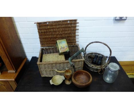 A mixed lot to include wicker baskets wooden bowls a plate, a vintage tin, horseshoe Architectural salvaged door handle, bino