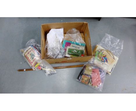 A carton containing a quantity of vintage needlework and sewing items to include vintage needles and pins in original packets
