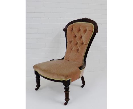 A mahogany framed pink upholstered button back chair with ceramic castors, 90 x 58cm