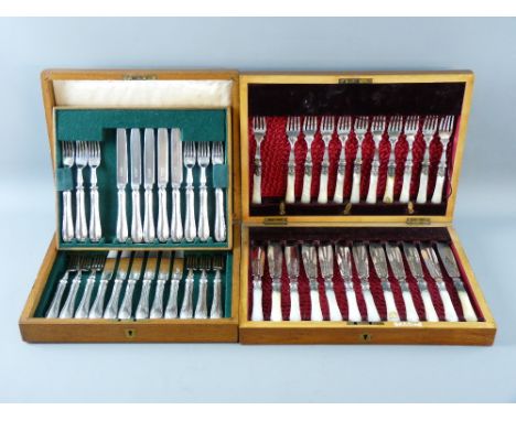 A WOODEN CANTEEN OF MOTHER OF PEARL HANDLED ELECTROPLATED FISH CUTLERY (one fork missing) and an oak canteen of twenty four M
