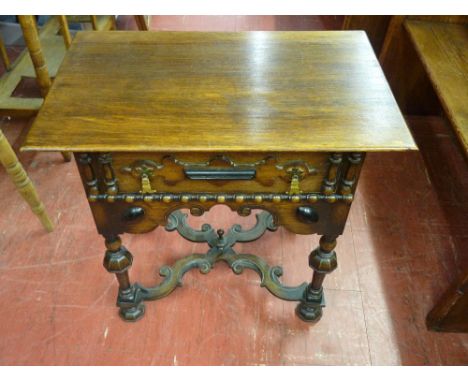 A REPRODUCTION OAK LOWBOY, 17th Century Dutch style having a rectangular top over a single frieze drawer with brass drop hand