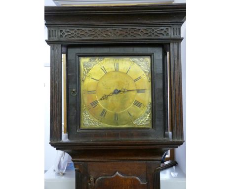 A CIRCA 1820 OAK CASED BRASS DIAL LONGCASE CLOCK by Lewis, Llanidloes, the 11.25 ins dial set with Roman numerals and figural