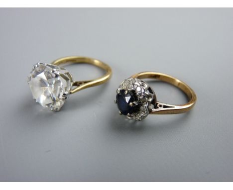 TWO NINE CARAT GOLD DRESS RINGS including a diamond set with central blue sapphire, size 'J' and a good sized cz in a high mo