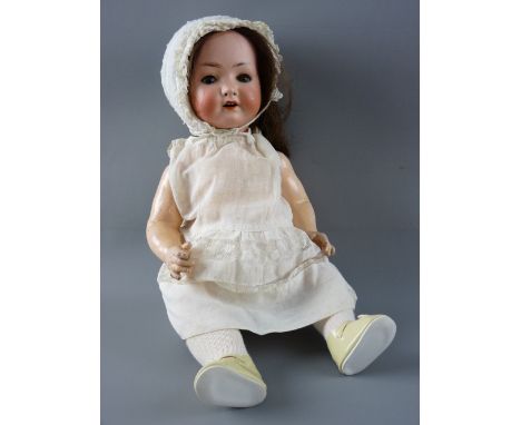 AN ANTIQUE BISQUE HEADED DOLL with composition body and limbs having sleepy blue eyes with lashes and painted detail, open mo