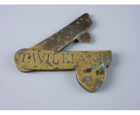 AN ANTIQUE BRASS VETERINARY FLEAM (blood letting tool), the two blade instrument stamped to the front 'T Williams', 9 cms lon