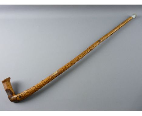 A NATURAL WOOD WALKING STICK carved in Welsh with the Ten Commandments, 93 cms long