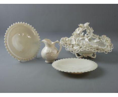 FOUR PIECES OF CREAM WARE STYLE PORCELAIN to include a Belleek jug with shamrock decoration in relief, a pair of 17.5 cms dia