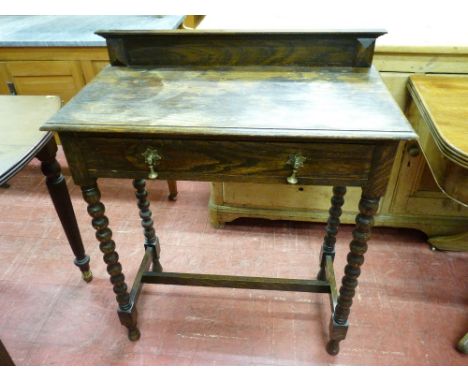 A VINTAGE OAK SINGLE DRAWER HALL TABLE with railback top and brass drop drawer handles on bobbin turned supports, 93.5 cms hi