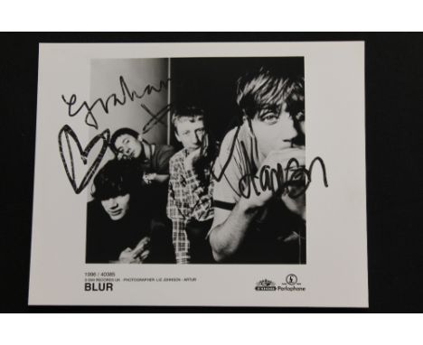BLUR - a 1996 black and white promotional photograph of the band Blur signed by Graham Coxon and Damon Albarn. Both signed in