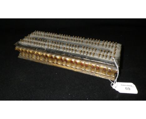 A 19th century iron and giltwood cribbage board