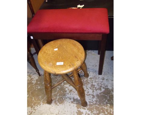 A 19th century elm stool and a stool with a red upholstered top