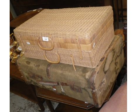 A vintage wooden bound suitcase and a picnic hamper
