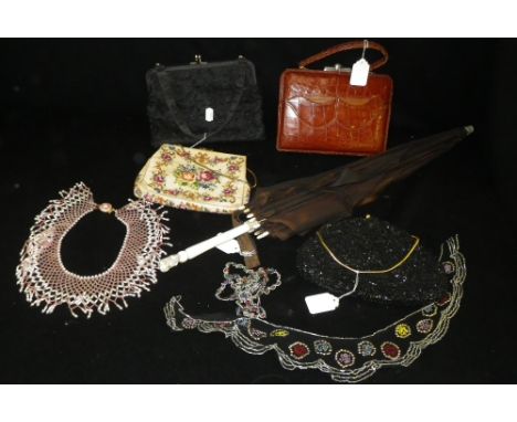 A small collection of vintage bags and a parasol