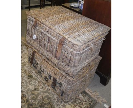 A vintage wicker laundry hamper and another similar