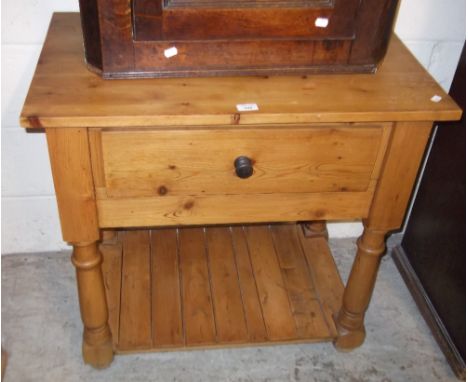 A pine kitchen cabinet fitted a single drawer with shelf below