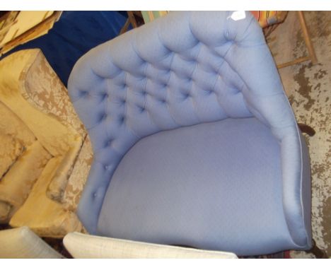 A small button-back two seater sofa upholstered in blue material