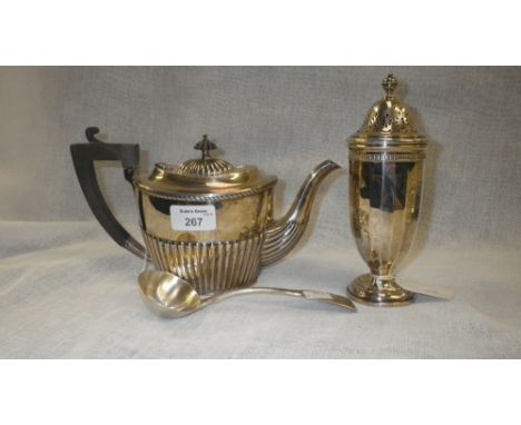 A Birmingham silver teapot with stop-fluted decoration, a Birmingham silver urn-shaped muffineer and a silver soup ladle (3)