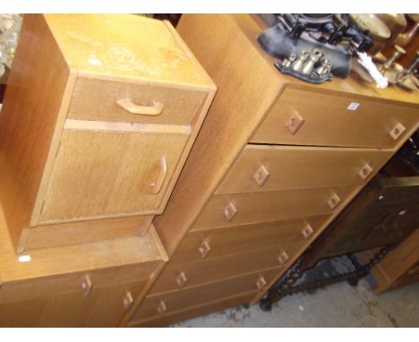 A light oak Stag chest of drawers, a similar bedside cabinet and a 1960s 'G Plan' oak bedside cabinet