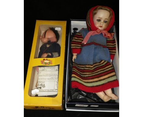 A Pelham Puppet Policeman and a similar doll