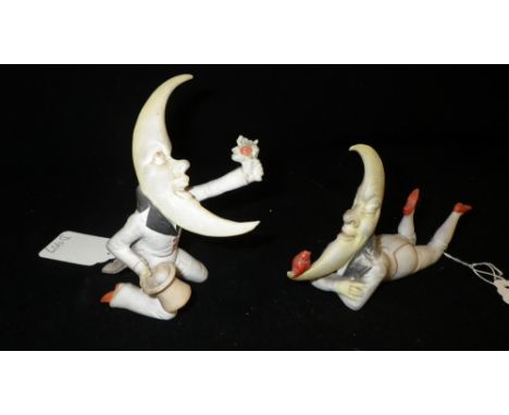 A pair of Bisque fairings of minstrels, the heads modelled as crescent moons 