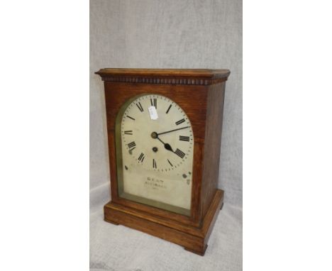 A late Victorian oak-cased mantel clock inscribed 'Dent, 61 Strand'