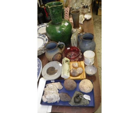 A pre-historic pebble hammer, similar items including fossils, an Art pottery jug and similar items