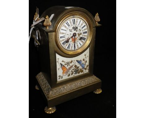 A 19th century brass-cased mantel clock with inset panels decorated with butterflies
