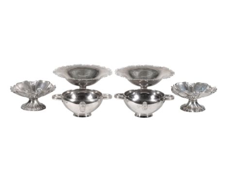  A pair of silver shaped circular pedestal dishes by William Neale  &  Son Ltd.,   Birmingham 1922, with chased C-scroll bord