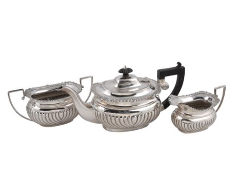  A silver oblong baluster three piece tea service by S. Blanckensee  &  Son Ltd,   Birmingham 1918, the tea pot with a lobed 