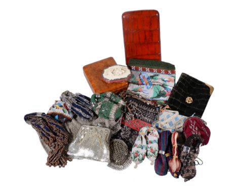 Ω A collection of purses, 19th and 20th century, including beaded, woven and embroidered examples, misers or stocking purses,