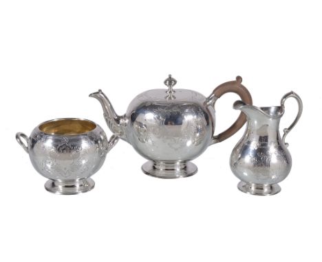  A matched Victorian silver bachelor's tea service by Robert Harper,   London 1865, the tea pot 1876, the bullet shape tea po