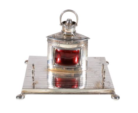  An Edwardian silver and red enamel novelty inkwell by John William Barrett,   Birmingham 1904, modelled as a ship's Port nav