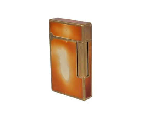  S. T. Dupont, a rectangular gas lighter,   gold plated with an amber/ white lacquer finish, in a matched Dupont box 