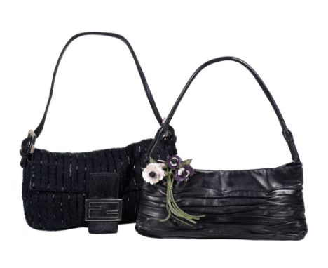  Fendi, a black clutch bag,   with a black leather loop handle, the flap opening to a green satin interior with a single zip 