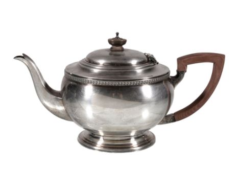  A silver compressed spherical tea pot by G. Bryan  &  Co.,   Birmingham 1946, with a composition button finial and angular h