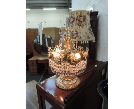 A modern brass and crystal effect table lamp