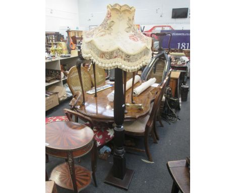 An early 20th century mahogany standard lamp having fluted colum and square base