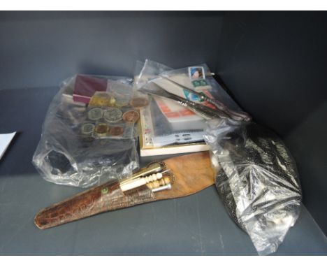 A selection of miscellaneous, including a bag of UK coins, loose stamps, plated sewing tools, etc