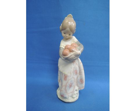 A Lladro study, girl with basket of oranges