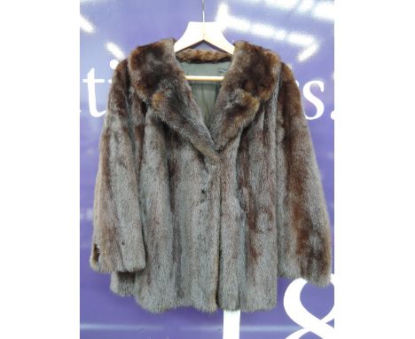 A ladies vintage chocolate mink swing jacket