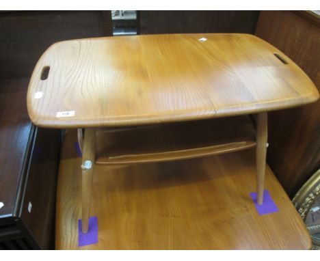 An Ercol style light elm coffee table having undertier 